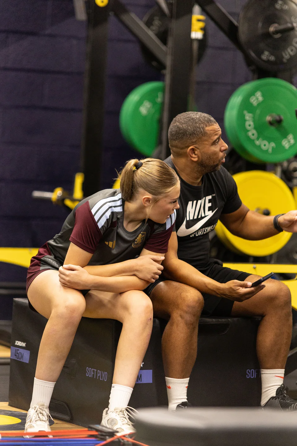 A Playermade coach and athlete talking through a training session